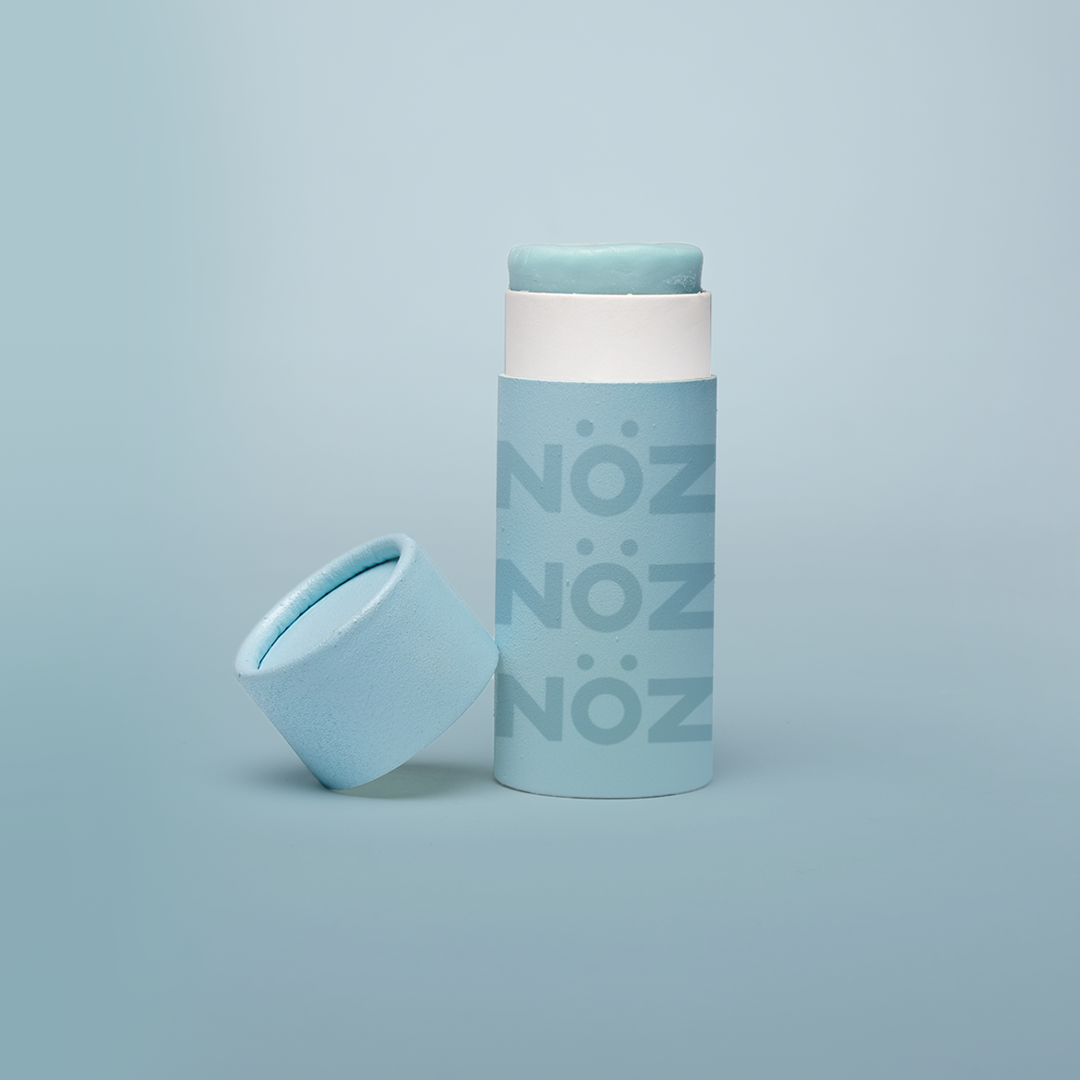 A bottle from blue, vegan, cruelty-free- reef safe Noz sunscreen