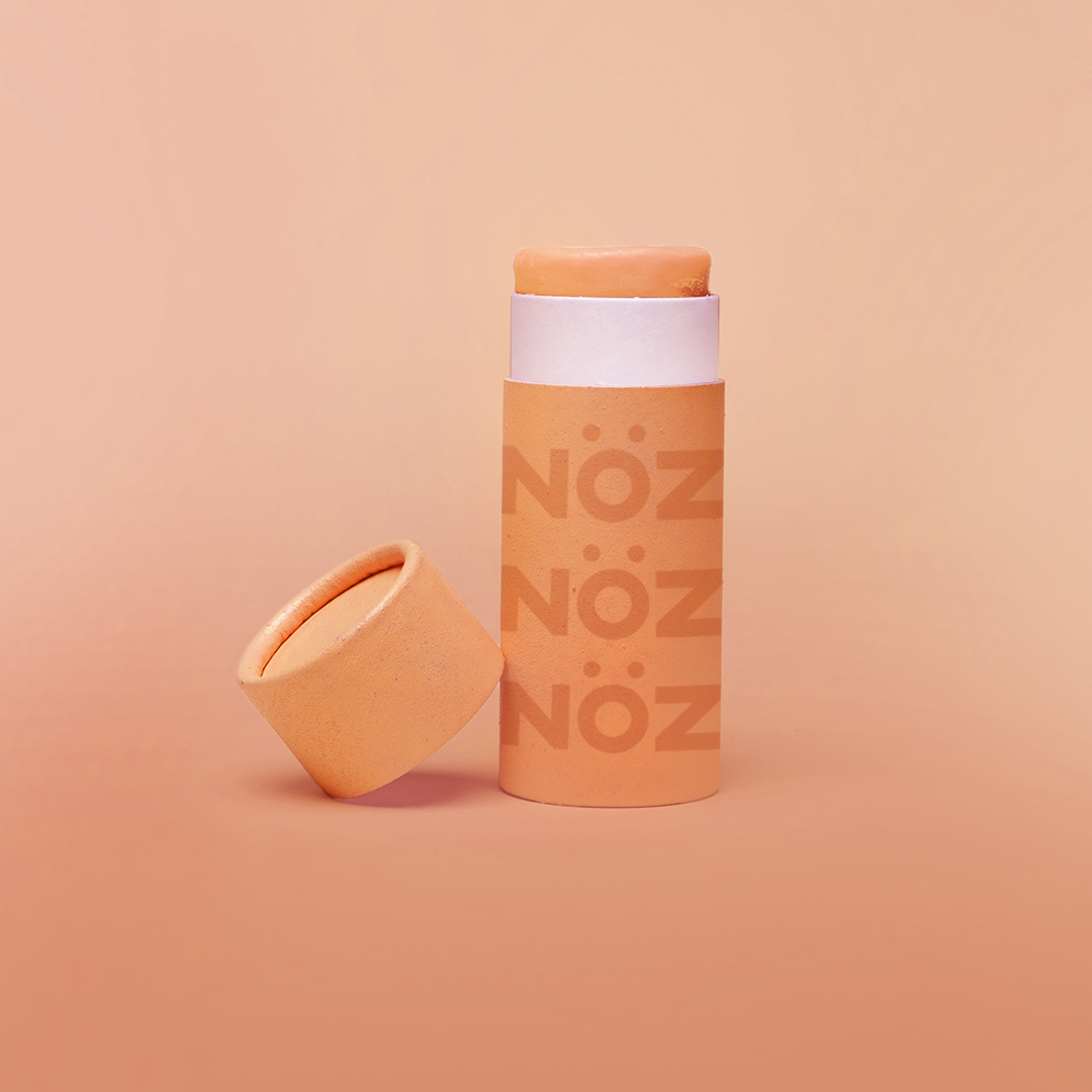 A bottle from orange, vegan, cruelty-free- reef safe Noz sunscreen